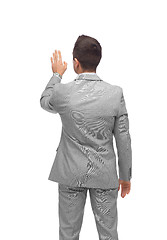 Image showing businessman touching something imaginary