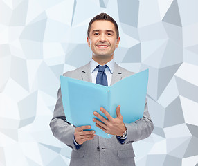 Image showing happy businessman with open folder