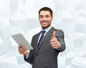 Image showing smiling businessman with tablet pc computer