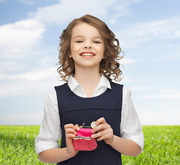 Image showing happy girl with purse and euro coin money