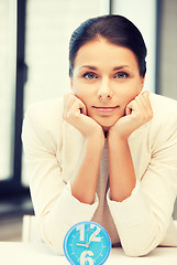 Image showing businesswoman with clock