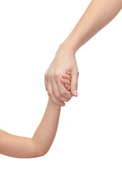 Image showing close up of woman and little girl holding hands