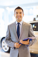 Image showing happy man at auto show or car salon