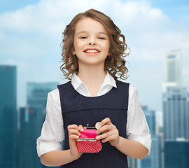 Image showing happy girl with purse and euro coin money