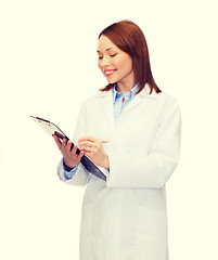 Image showing smiling female doctor with clipboard