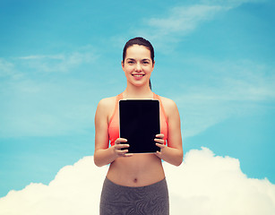 Image showing sporty woman with tablet pc blank screen