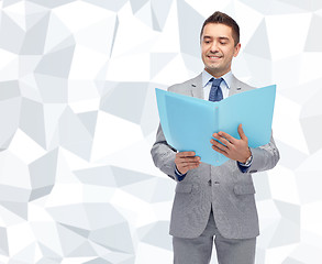 Image showing happy businessman with open folder