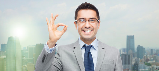 Image showing happy smiling businessman in eyeglasses and suit