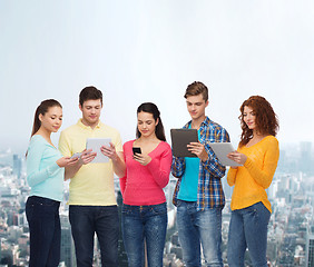 Image showing group of teenagers with smartphones and tablet pc