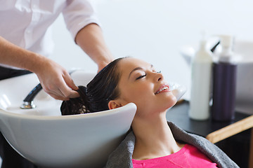 Image showing happy young woman at hair salon