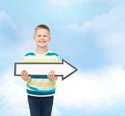 Image showing smiling little boy with blank arrow pointing right