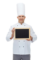 Image showing happy male chef cook holding blank menu board