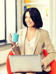 Image showing happy woman with laptop computer