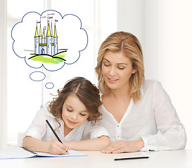 Image showing happy mother and daughter drawing at home