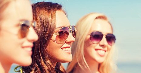 Image showing close up of smiling young women in sunglasses