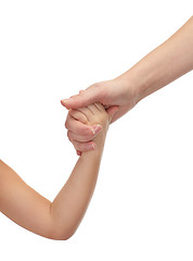 Image showing close up of woman and little girl holding hands