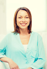 Image showing smiling woman at home