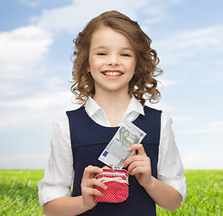 Image showing happy girl with purse and paper money