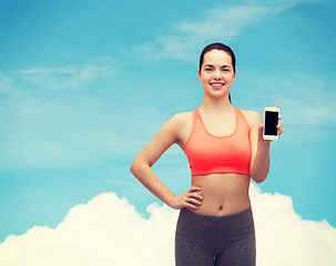 Image showing sporty woman with smartphone