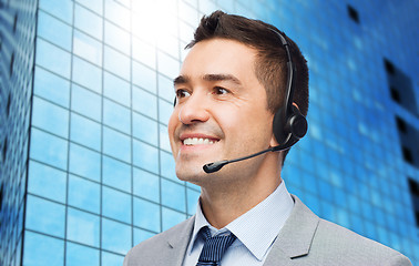 Image showing smiling businessman in headset