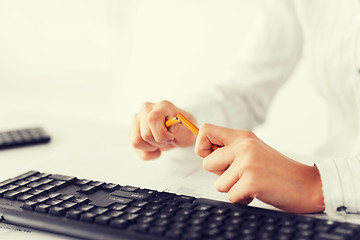 Image showing woman breaking pencil