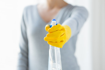 Image showing close up of happy woman with cleanser spraying