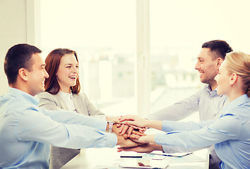 Image showing business team celebrating victory in office