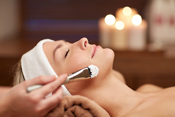 Image showing close up of young woman and cosmetologist in spa