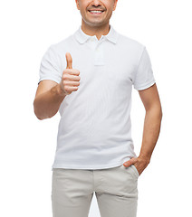 Image showing smiling man showing thumbs up