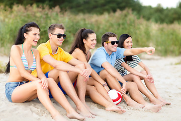 Image showing group of happy friends on beach