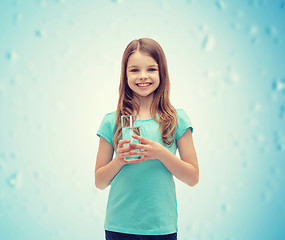 Image showing smiling little girl with glass of water