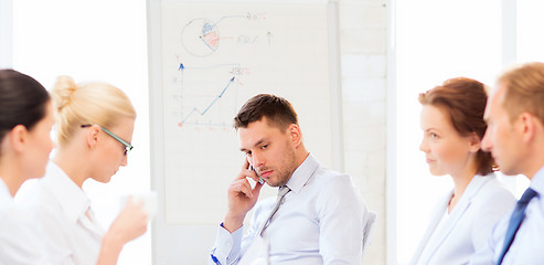 Image showing stressed male boss on business meeting