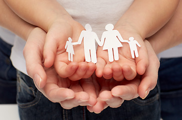 Image showing close up of woman and girl hands with paper family