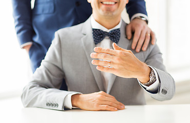 Image showing close up of male gay couple with wedding rings on