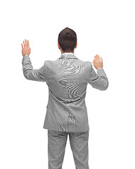 Image showing businessman touching something imaginary