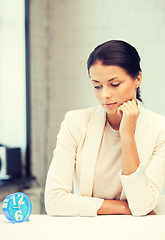 Image showing businesswoman with clock