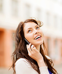 Image showing young woman talking on the phone