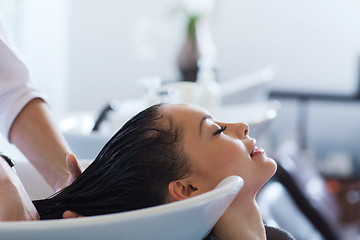 Image showing happy young woman at hair salon