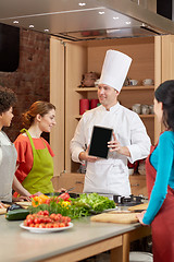 Image showing happy women with chef and tablet pc in kitchen