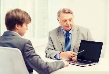 Image showing older man and young man with laptop computer