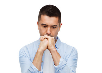 Image showing unhappy man thinking