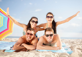 Image showing group of happy friends having fun on beach