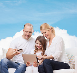 Image showing happy family with tablet pc and credit card