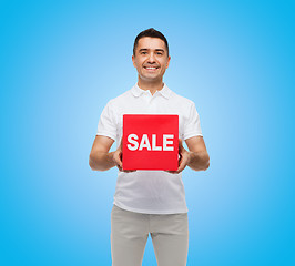 Image showing smiling man with red sale sigh