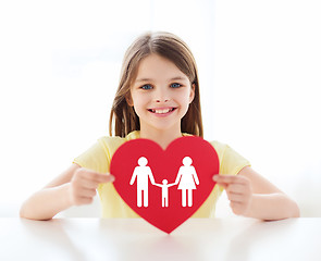 Image showing smiling little girl with red heart and family