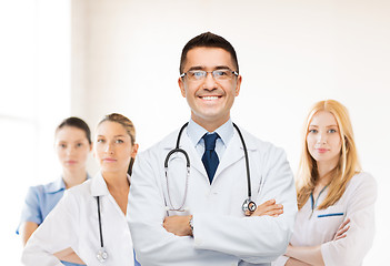 Image showing smiling male doctor in white coat at hospital