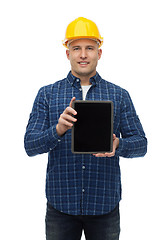 Image showing smiling male builder in helmet with tablet pc