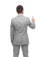 Image showing businessman pointing finger or touching something