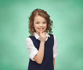 Image showing happy girl showing hush gesture