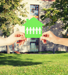 Image showing man and woman hands with paper house